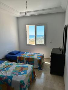 Postel nebo postele na pokoji v ubytování Magnifique S2 vue mer