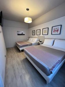Postel nebo postele na pokoji v ubytování Hotel La Pace