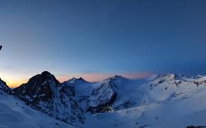 a snow covered mountain range with the sunset in the background at NEW ENTRY - Nuova villa nel verde in Mezzana