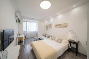 Et tv og/eller underholdning på Jingyi Apartment