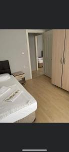 an empty room with a bed and a room with a bedroom at EDİRNE EYLÜL PANSİYOn in Edirne