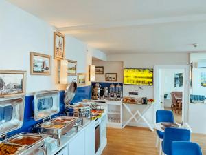a kitchen with a counter with food on it at Batumi River Source in Batumi