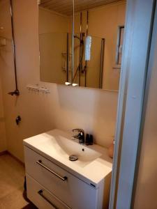 a bathroom with a sink and a mirror at Rantatalo in Pori +22 photos