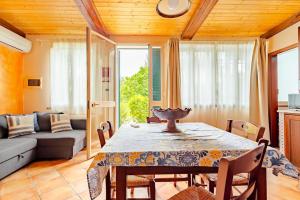 a living room with a table and a couch at Casa della Zagara in Acireale