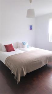 Ένα ή περισσότερα κρεβάτια σε δωμάτιο στο Praia Mar