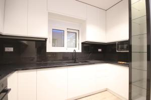 Kuchyň nebo kuchyňský kout v ubytování Klea Rooms + 37 fotografií