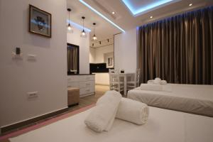 Postel nebo postele na pokoji v ubytování Klea Rooms