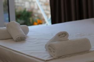Postel nebo postele na pokoji v ubytování Klea Rooms