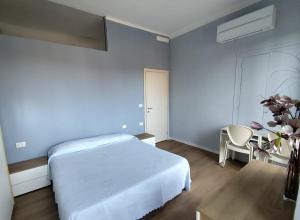 Ένα ή περισσότερα κρεβάτια σε δωμάτιο στο Casa Odette