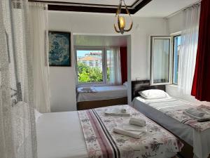 Кровать или кровати в номере Bonjourla Otel