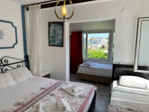 Кровать или кровати в номере Bonjourla Otel