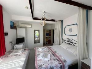 Кровать или кровати в номере Bonjourla Otel