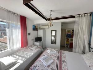 Кровать или кровати в номере Bonjourla Otel