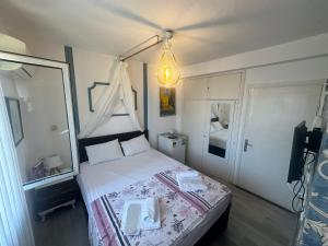 Кровать или кровати в номере Bonjourla Otel