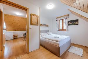 Postel nebo postele na pokoji v ubytování Valašský dvůr
