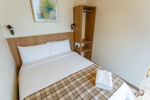 Postel nebo postele na pokoji v ubytování Vistara Suites