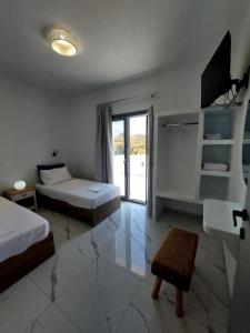 Кровать или кровати в номере Cledari Plaka Appartments