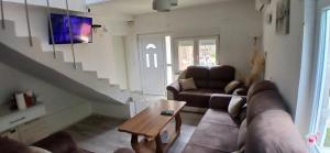 a living room with a couch and a table at Sara&Sami in Mostar