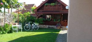a house with a bike parked in the yard at Sara&Sami in Mostar