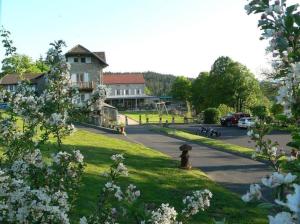 a street with a building and a fire hydrant in the grass at Hob Fort du Pré in Saint-Bonnet-le-Froid +74 photos