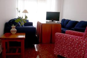 Televízia a/alebo spoločenská miestnosť v ubytovaní Casa Soleada en Calle Tranquila