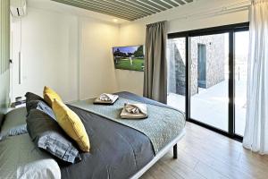 a bedroom with a bed with two napkins on it at Salobre Las Yucas 5 in Salobre