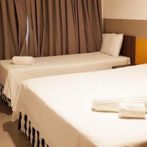 Postel nebo postele na pokoji v ubytování Resort em Olimpia + 5 fotografií