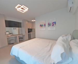 a white bedroom with a large white bed in it at Casa Del Sol Luxury House in Xylokastron +20 photos