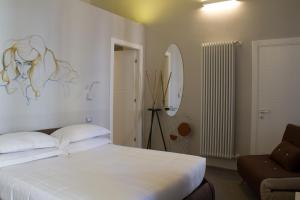 Postel nebo postele na pokoji v ubytování Piazza Castello Suite