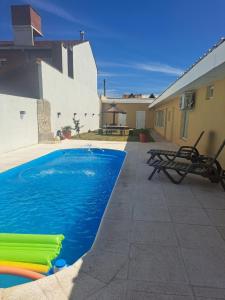 a swimming pool on the side of a house at Palma de Mallorca 173 in Santa Clara del Mar