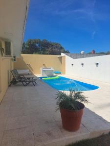 a swimming pool on the side of a house at Palma de Mallorca 173 in Santa Clara del Mar
