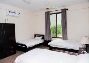 Postel nebo postele na pokoji v ubytování Travel Nexus