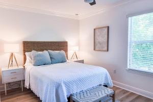 a white bedroom with a bed and a window at Walk to Rosemary - Poolside, 6 Bikes, Beach Access in Inlet Beach +76 photos