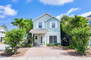 a blue house with trees in front of it at Walk to Rosemary - Poolside, 6 Bikes, Beach Access in Inlet Beach