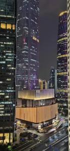 a view of a city at night with tall buildings at K Apartment Guangzhou in Guangzhou