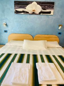Llit o llits en una habitació de Residence Cigno