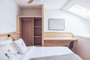 Postel nebo postele na pokoji v ubytování Le Clos du 5 - Appart Hotel Bagneres