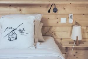 Postel nebo postele na pokoji v ubytování Le Clos du 5 - Appart Hotel Bagneres