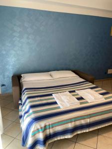 Llit o llits en una habitació de Residence Cigno