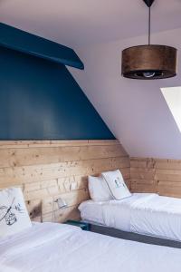 Postel nebo postele na pokoji v ubytování Le Clos du 5 - Appart Hotel Bagneres