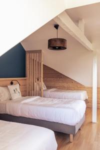 Postel nebo postele na pokoji v ubytování Le Clos du 5 - Appart Hotel Bagneres