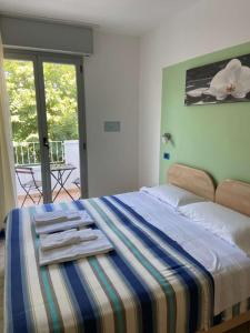 Llit o llits en una habitació de Residence Cigno