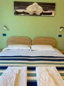 Llit o llits en una habitació de Residence Cigno