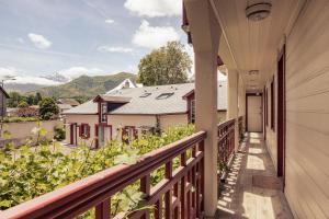 a balcony with a view of the mountains at Le Clos du 5 - Appart Hotel Bagneres in Bagnères-de-Bigorre
