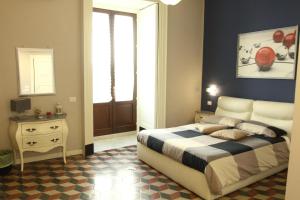 Letto o letti in una camera di B&B Suite Cutelli