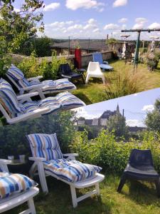 a group of chairs sitting in the grass at Une chambre en ville in Domfront