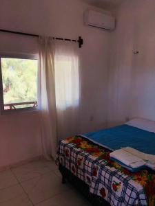 Ένα ή περισσότερα κρεβάτια σε δωμάτιο στο Casa do mar