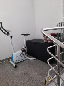 a room with a bike next to a bed at Apartmani Seka 1 in Zečevo