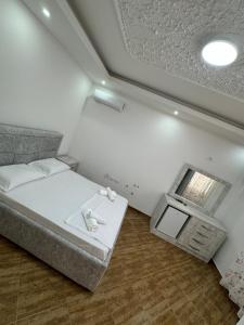 Postel nebo postele na pokoji v ubytování Restorant Hotel Niku + 10 fotografií