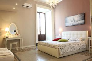 Letto o letti in una camera di B&B Suite Cutelli
